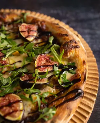 This ones got it all… seasonality, zing, colour and best of all, our mozzarella 🫶 Our Fig Pizza starts with hand-stretc...