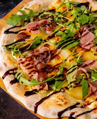 An unusual pear-ing(😉) that will pleasantly surprise you! This sweet and savoury pizza features pear, prosciutto and pu...